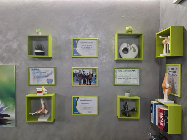 Diplomas and certificates on the wall of the practice