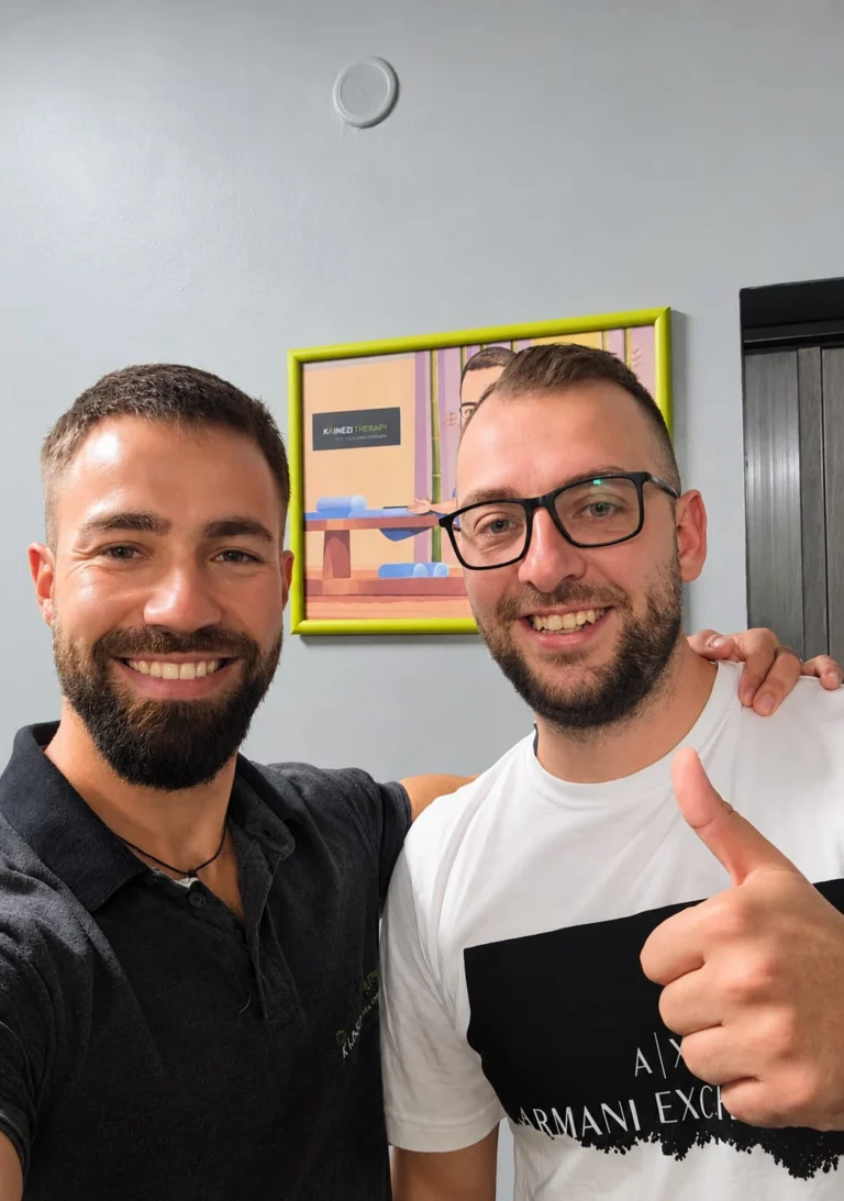Kaloyan Zarkov and a smiling patient in glasses giving a thumbs-up