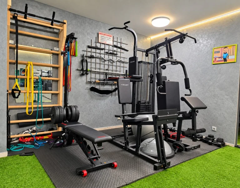 Exercise room with wall bars, resistance bands and a multi-gym