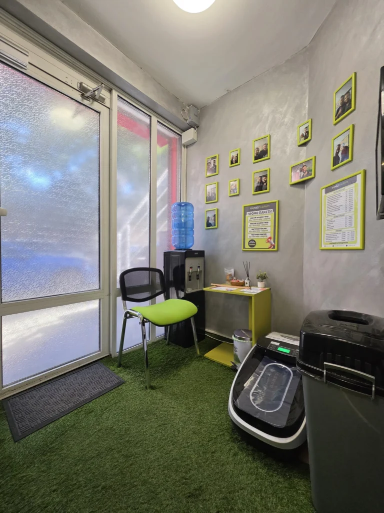Waiting area by the entrance, with a chair and a water dispenser